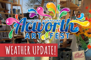 Sign for "Historic Downtown Acworth Art Fest" with flowers and decorative items. Text overlay: "Weather Update!.