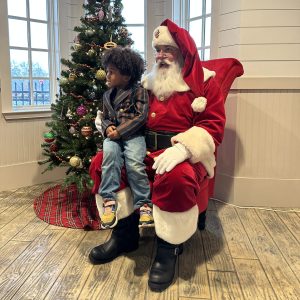 Image Santa with Little Boy on Lap Posing for a Photo