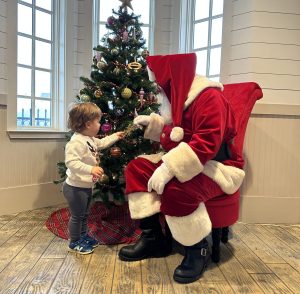 Image Santa with Toddler Looking at Christmas Tree Ornament