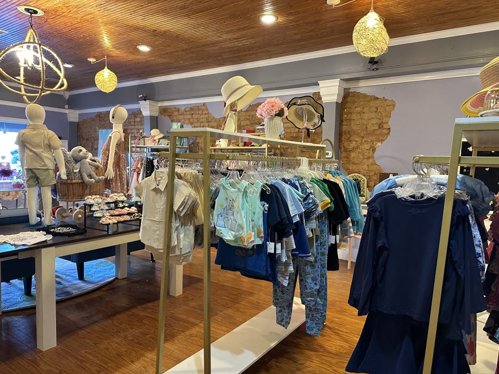 Image Interior of Bows and Ties Children's Boutique in Historic Downtown Acworth Featuring Children's Clothing.