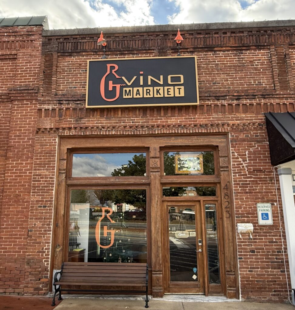 Brick building facade with a sign reading 