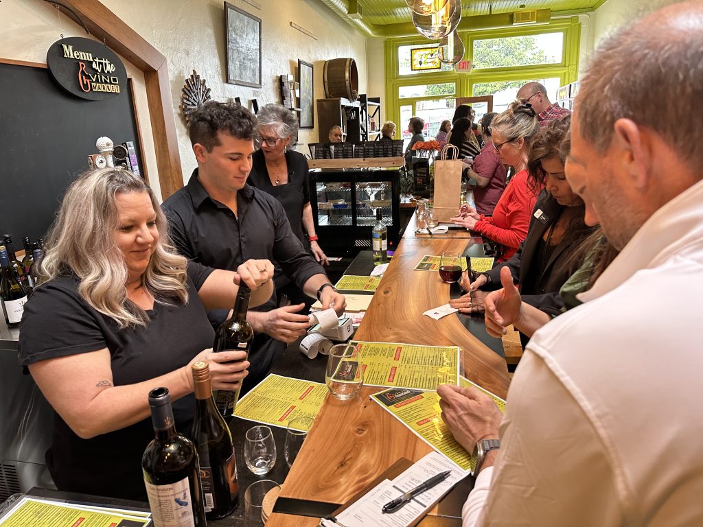 Image People Being Served at Wine Bar by Friendly Employees at TRG Vino Market in Acworth
