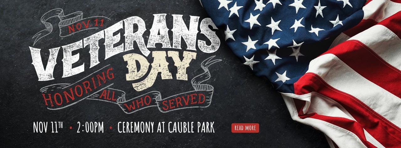 Text graphic for Veterans Day event on November 11 at 2:00 PM at Cauble Park, honoring all who served, next to a folded American flag.