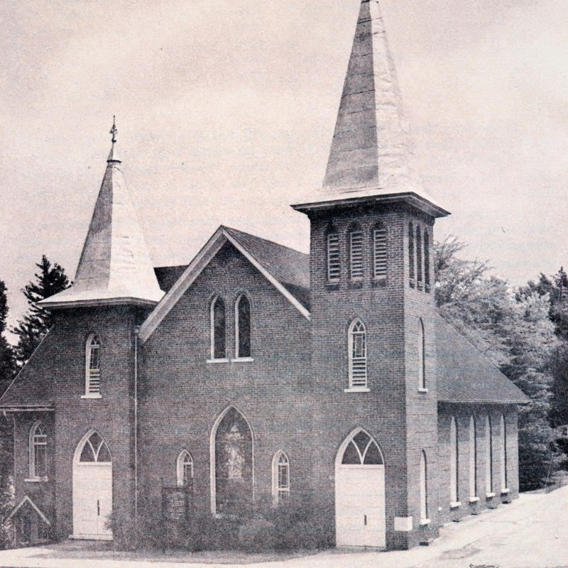 Black and white photo of a brick church with two tall steeples, arched windows, and multiple white doors, surrounded by trees. Learn More About Historic Acworth Locations through this striking image. Black and white photo of a brick church with two tall steeples, arched windows, and multiple white doors, surrounded by trees. Learn More About Historic Acworth Locations through this striking image.