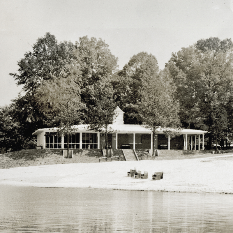 A single-story building with large windows sits on a sandy shore, surrounded by trees and historic Acworth locations, with a few benches and boxes near the water’s edge. Learn More About Historic Acworth Locations. A single-story building with large windows sits on a sandy shore, surrounded by trees and historic Acworth locations, with a few benches and boxes near the water’s edge. Learn More About Historic Acworth Locations.