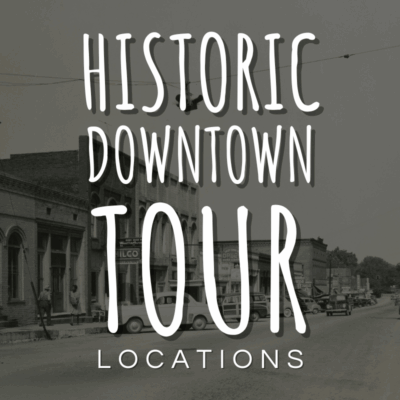 Black-and-white photo of a small town street with older buildings and vintage cars, overlaid with text reading "Historic Downtown Tour Locations.