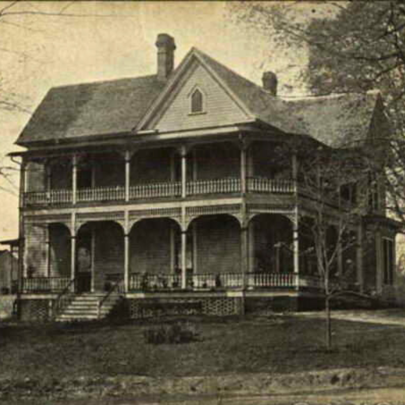 Two-story wooden house with wraparound porch, decorative railings, and a steep roof, surrounded by trees and a grassy yard. Learn more about historic Acworth locations like this charming residence. Two-story wooden house with wraparound porch, decorative railings, and a steep roof, surrounded by trees and a grassy yard. Learn more about historic Acworth locations like this charming residence.