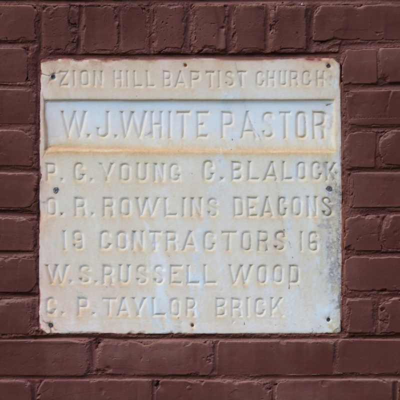 Plaque on a brick wall reads: “Zion Hill Baptist Church. W.J. White Pastor. P.C. Young, G. Blalock, O.R. Rowlins Deacons. 19 Contractors 16. W.S. Russell Wood, G.P. Taylor Brick.” Learn More About Historic Acworth Locations here. Plaque on a brick wall reads: "Zion Hill Baptist Church. W.J. White Pastor. P.C. Young, G. Blalock, O.R. Rowlins Deacons. 19 Contractors 16. W.S. Russell Wood, G.P. Taylor Brick." Learn More About Historic Acworth Locations here.