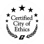 Black and white badge with three stars, laurel branches, and the text "Certified City of Ethics" in the center. A small emblem appears at the bottom.