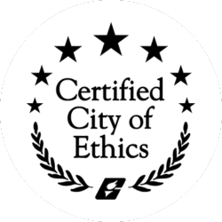 Black and white badge with three stars, laurel branches, and the text "Certified City of Ethics" in the center. A small emblem appears at the bottom.