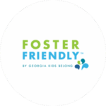 The image displays the Foster Friendly logo by Georgia Kids Belong, featuring green and blue text with a small abstract graphic.