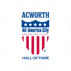 Logo for Acworth’s All-America City Hall of Fame, featuring a shield with stars and stripes and the text “National Civic League.”.