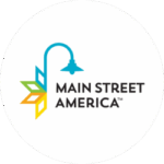 Main Street America logo with a blue lamp post and colorful geometric leaves to the left of black text reading "Main Street America.