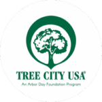 Green logo of a tree inside a circle above the words "TREE CITY USA, An Arbor Day Foundation Program" on a white background.