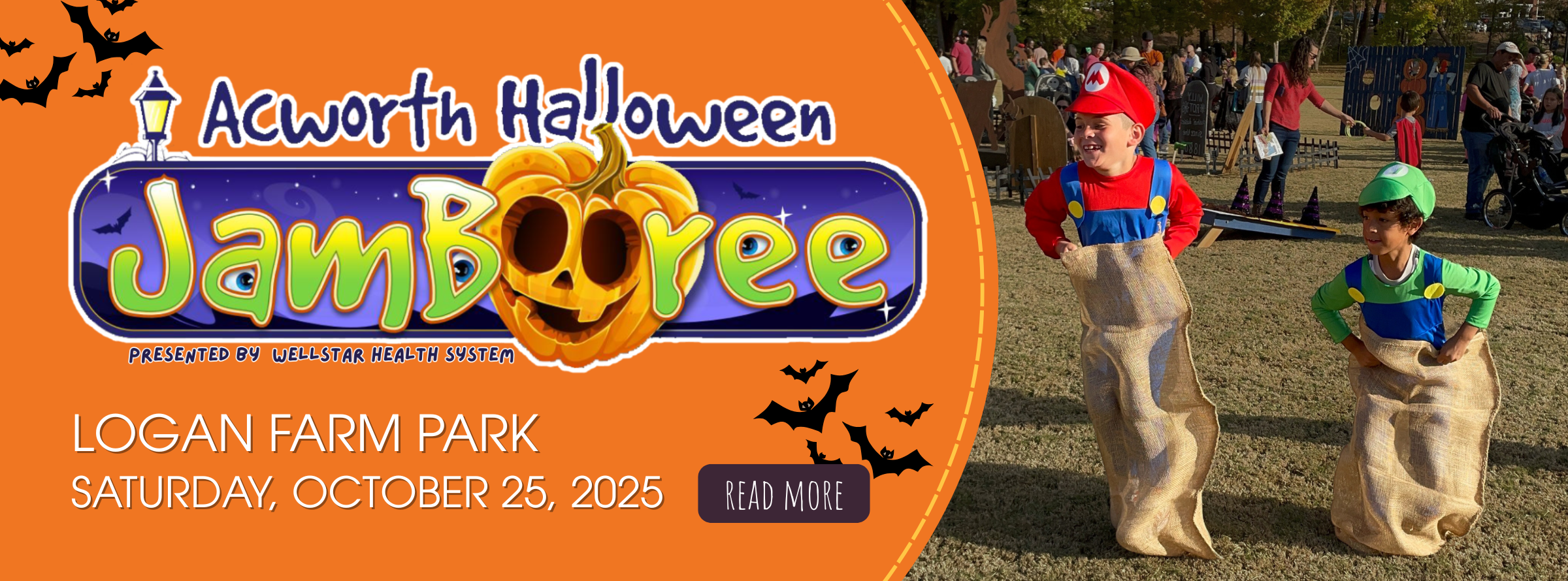Two children in Mario and Luigi costumes participate in a sack race at a Halloween event in a park, with people and decorations in the background.