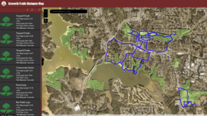 A satellite map displays Trails in Acworth, Georgia, with marked walking paths in blue. A sidebar lists trail names, distances, and parking locations at Logan Farm Park.