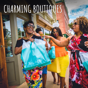 Four women carrying shopping bags walk out of a boutique on a sunny day, smiling and conversing. The words "Charming Boutiques" and "You're Welcome in Acworth" appear at the top of the image.
