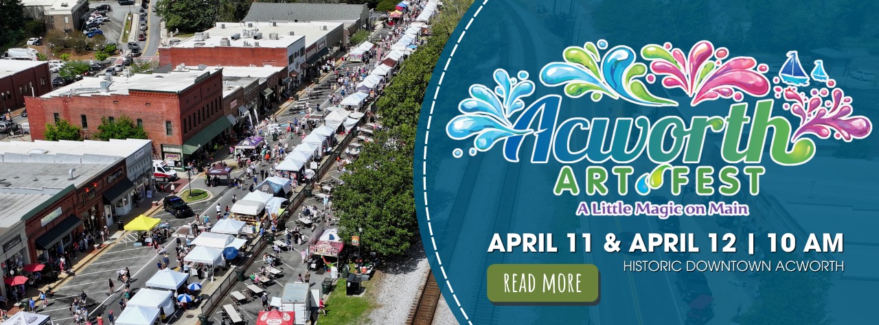Aerial view of Acworth Art Fest with vendor tents lining the street; event dates are April 11 & April 12 at 10 AM in historic downtown Acworth.