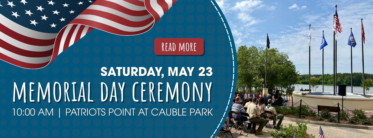 Banner for a Memorial Day ceremony on Saturday, May 23 at 10:00 AM, Patriots Point at Cauble Park, with people seated outdoors by flagpoles and a lake.