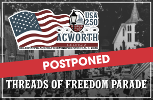 Graphic announcing the postponement of the "Threads of Freedom Parade" in Acworth, Georgia, for the USA 250 celebration, with a U.S. flag and historic downtown background.