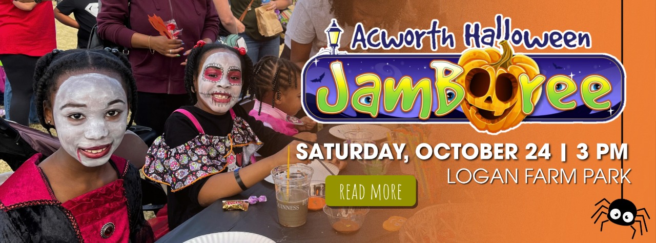 Children in costumes with painted faces sit at a table with crafts at the Acworth Halloween Jamboree event, held Saturday, October 24 at 3 PM at Logan Farm Park.