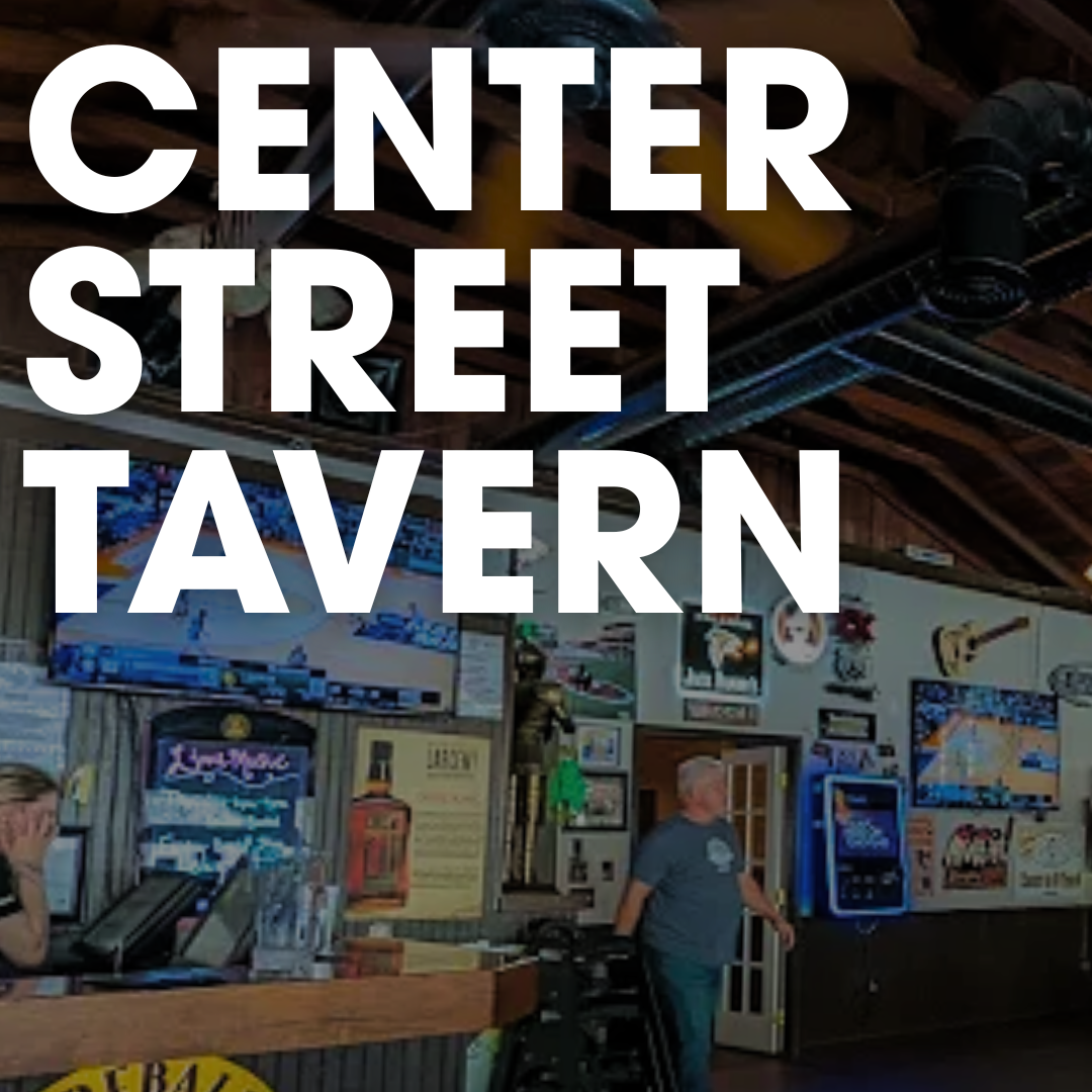 Interior of Center Street Tavern, a popular place to watch football in Acworth this fall, featuring a bar, wall decor, and patrons.